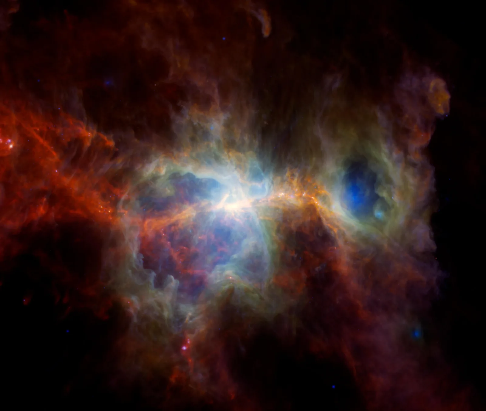 赤やオレンジ、青に輝くガスとちりが広がるオリオン大星雲